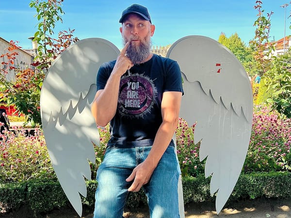 Man in Front of Angel Wings